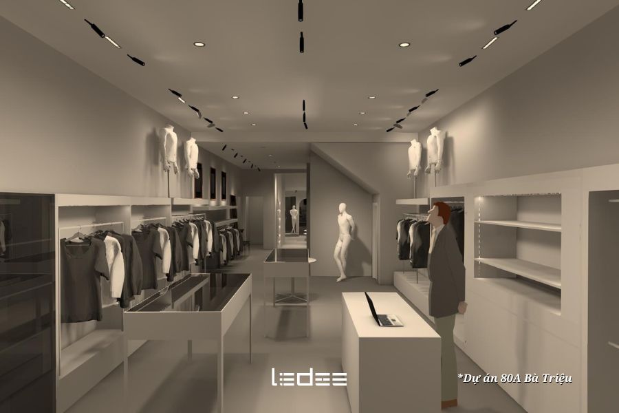 5 loại đèn chiếu sáng nghệ thuật 2026 mà dân kiến trúc cần cập nhật 13 Không gian showroom với hệ đèn ray nam châm chiếu vào sản phẩm, ánh sáng tạo điểm nhấn rõ ràng.